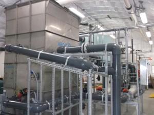 Interior of DAF treatment plant. There are a series to pipes winding around and through a large rectangualar structure.